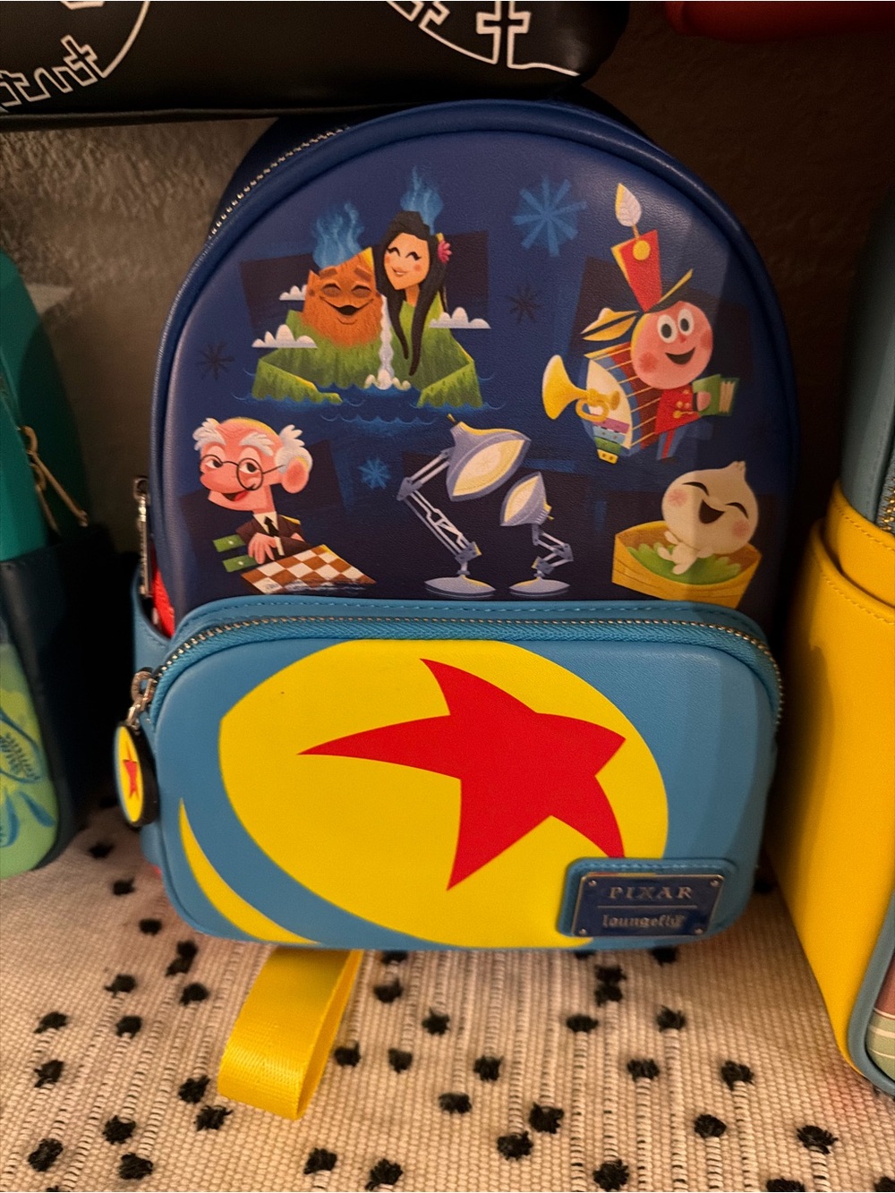 Loungefly Pixar Character Mini Backpack in Blue, Yellow & Red